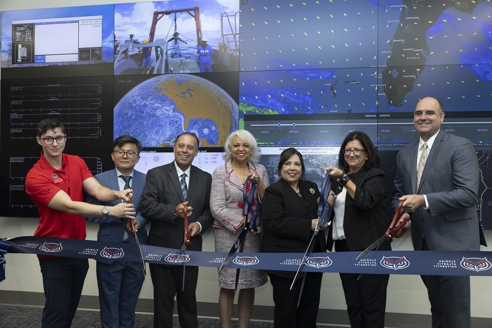 (From left): James VanZwieten Jr., Ph.D.; co-director, FPL InETech; Stella Batalama, Ph.D.; dean, FAU College of Engineering and Computer Science; FAU President Stacy Volnick; Juliet Roulhac; FPL director of external affairs, Broward and Southwest regions, and director of corporate philanthropy, NextEra Energy, Inc.; Manny Miranda, FPL executive vice president of power delivery; Yufei Tang, Ph.D.; director, FPL InETech; and Carter Nichols, FAU undergraduate student in electrical engineering. (Photo by Alex Dolce)